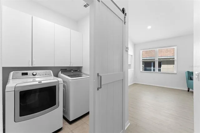 an aerial view of residential houses with outdoor space and swimming pool
