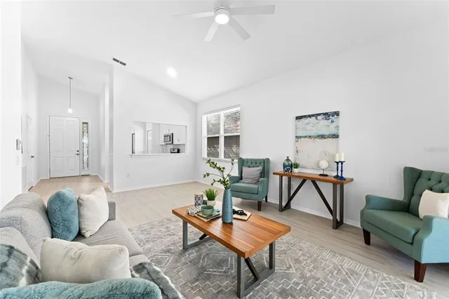 a view of a kitchen with wooden floor and a window