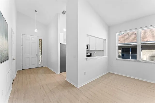 a kitchen with stainless steel appliances granite countertop a sink stove and microwave