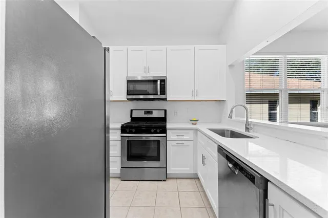 a view of a dining room with furniture and window