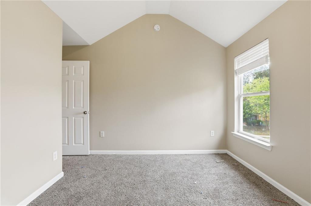 4968 Locherby Drive Fairburn, GA 30213 - Photo 28 of 39 an empty room with windows and closet