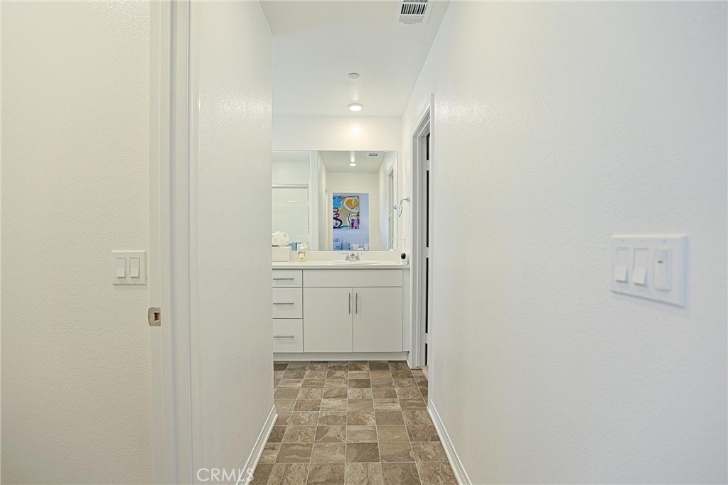 7486 Olive Grv Street Riverside, CA 92507 - Photo 29 of 57 a bathroom with a sink and a mirror