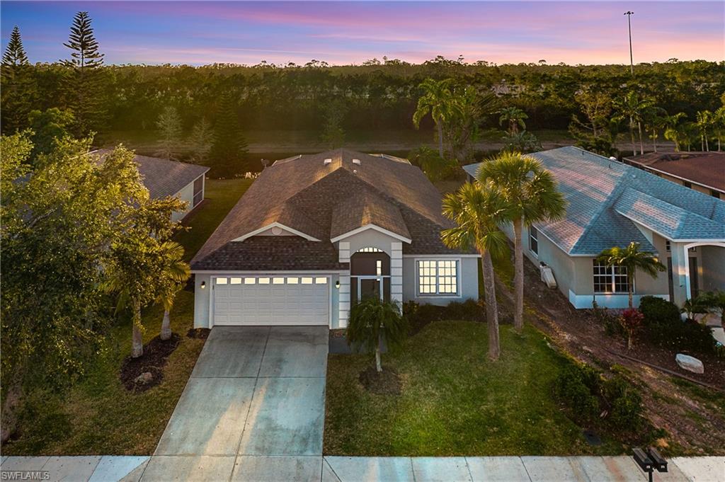 21722 Windham Run Estero, FL 33928 - Photo 1 of 40 a view of a house with a yard