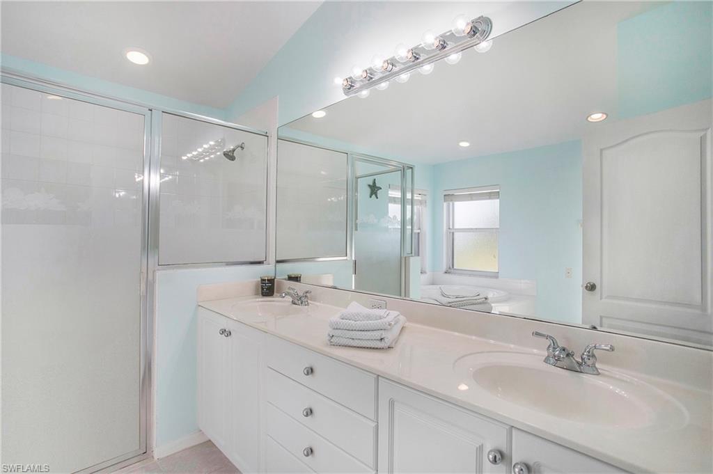 21722 Windham Run Estero, FL 33928 - Photo 14 of 40 a bathroom with a double vanity sink mirror and double
