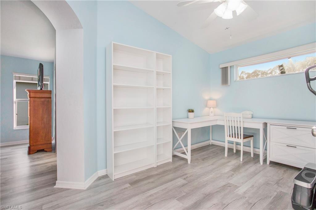 21722 Windham Run Estero, FL 33928 - Photo 20 of 40 a view of a workspace with furniture and wooden floor