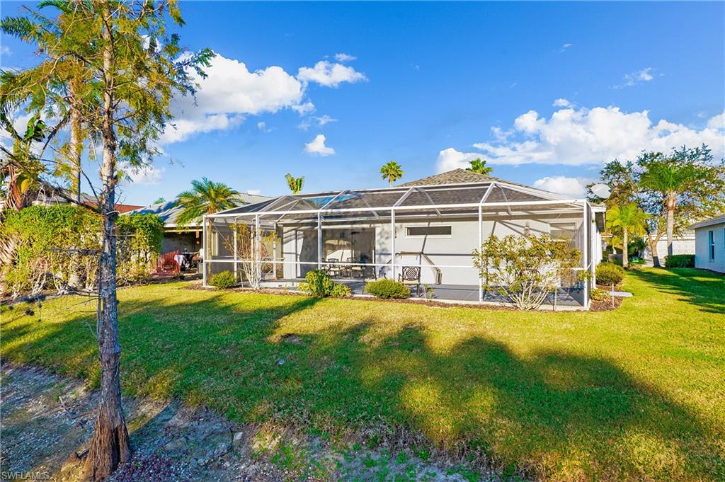 21722 Windham Run Estero, FL 33928 - Photo 27 of 40 a view of a house with swimming pool and porch with furniture