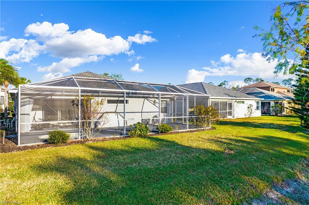 21722 Windham Run Estero, FL 33928 - Photo 28 of 40 a view of a house with a swimming pool