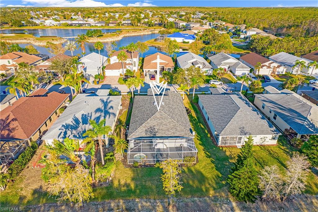 21722 Windham Run Estero, FL 33928 - Photo 30 of 40 an aerial view of residential houses with outdoor space and swimming pool