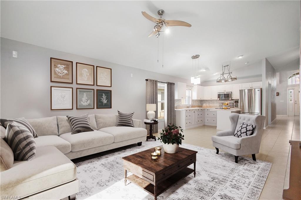 21722 Windham Run Estero, FL 33928 - Photo 3 of 40 a living room with furniture and a table