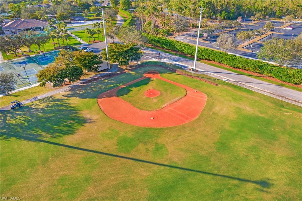 21722 Windham Run Estero, FL 33928 - Photo 40 of 40 a view of a swimming pool with a yard and plants