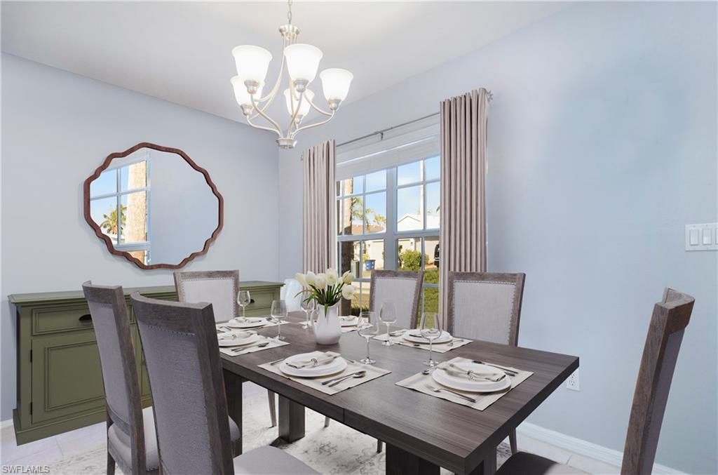 21722 Windham Run Estero, FL 33928 - Photo 4 of 40 a view of a dining room with furniture a chandelier and wooden floor