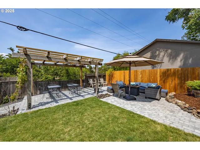 a view of yard with patio