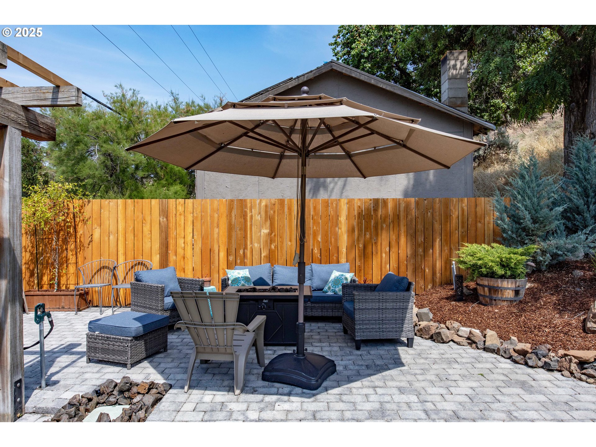 210 Hartman Avenue Maupin, OR 97037 - Photo 12 of 46 a view of a outdoor sitting area with furniture and umbrella