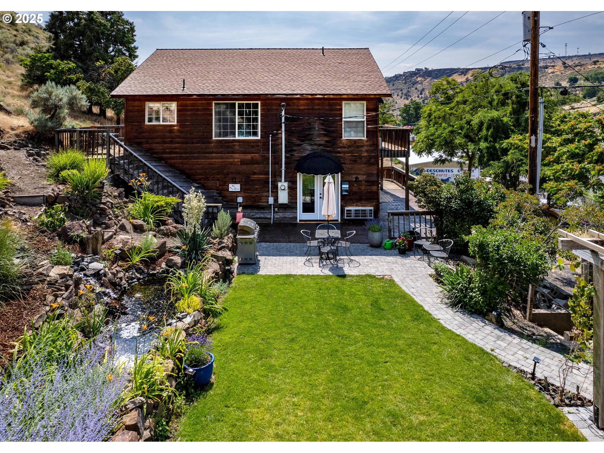 210 Hartman Avenue Maupin, OR 97037 - Photo 13 of 46 a house view with a garden space