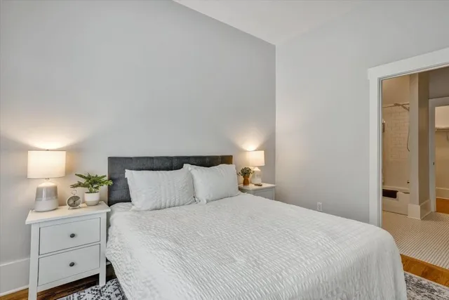 a bedroom with a bed and window