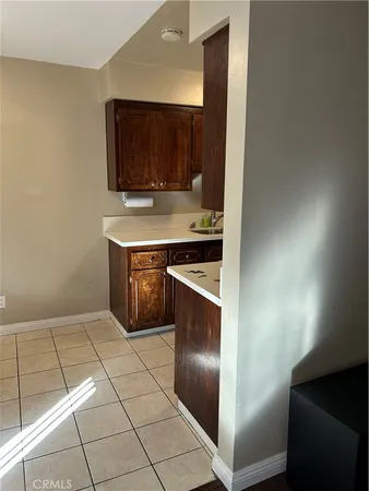 a kitchen with stainless steel appliances a stove a microwave and a sink