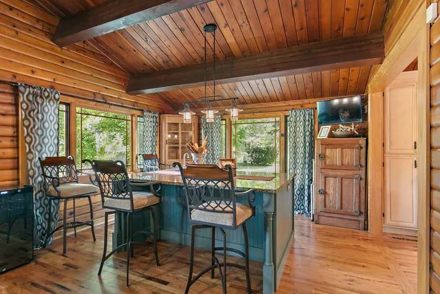 a view of a dining room with furniture window and outside view