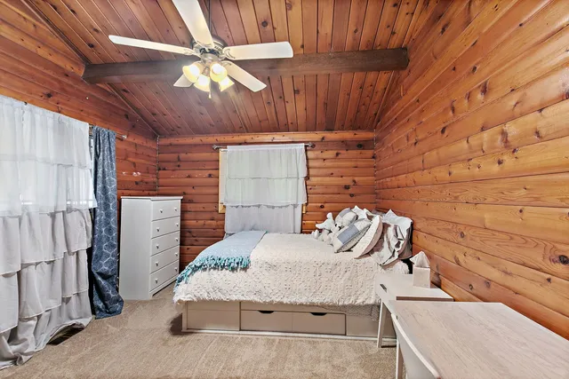 a living room with furniture and a glass door