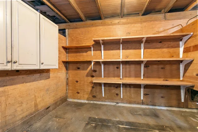 a view of a storage room with wooden floor