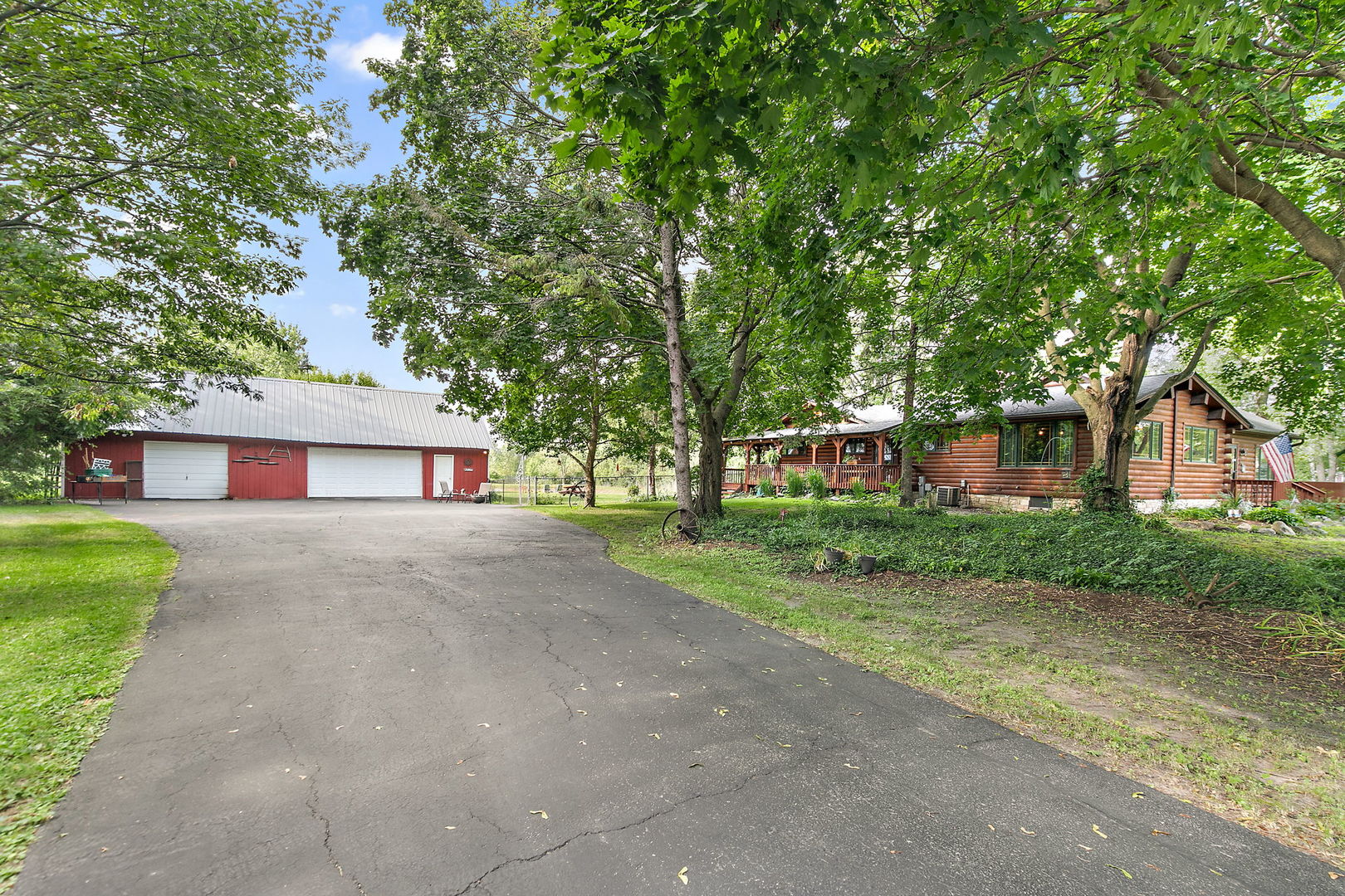 41W591 Lenz Road Elgin, IL 60124 - Photo 4 of 48 a front view of a house with a garden and trees