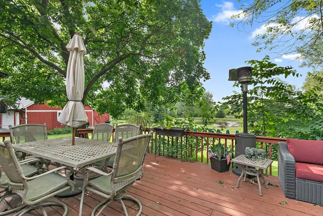an aerial view of a residential houses with yard