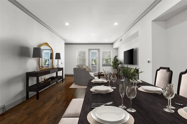 a living room with furniture fireplace and flat screen tv