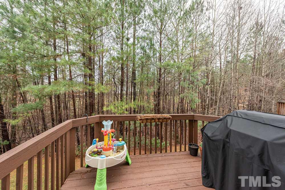 8451 Reedy Ridge Lane Raleigh, NC 27613 - Photo 28 of 30 Wooden deck off main level - great for grilling and entertaining.