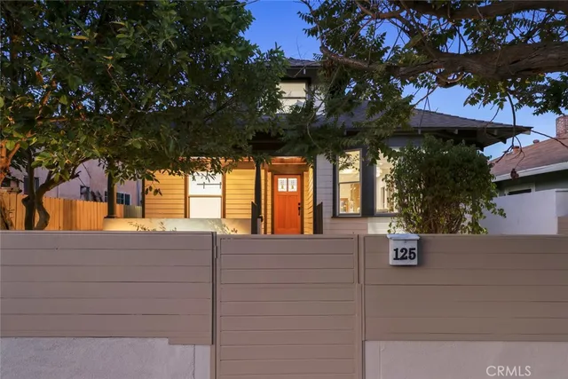 an aerial view of a house with outdoor space