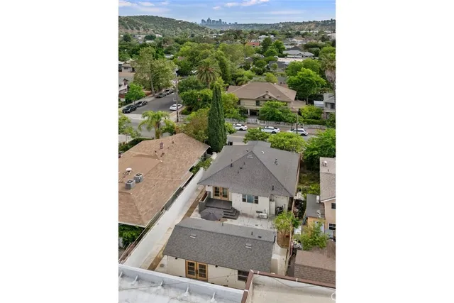 an aerial view of a house with a yard