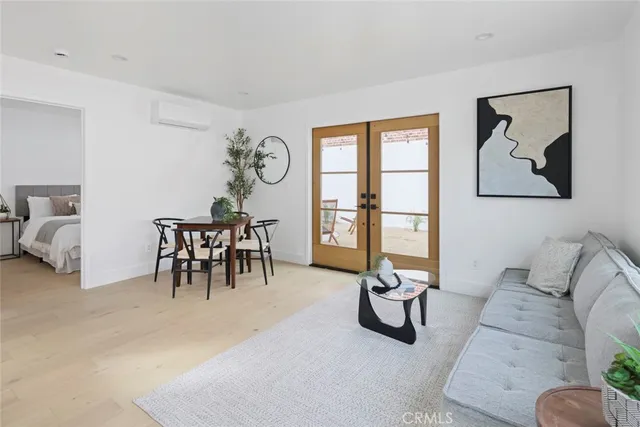 a view of a patio with table and chairs potted plants