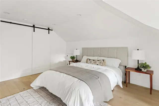 a bathroom with a toilet a sink and a mirror