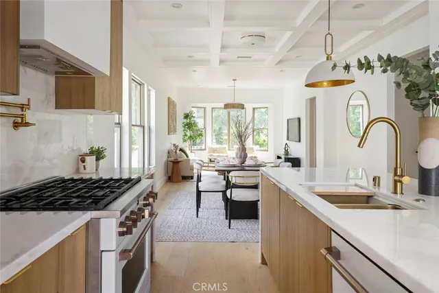 a view of a dining room with furniture large windows and wooden floor