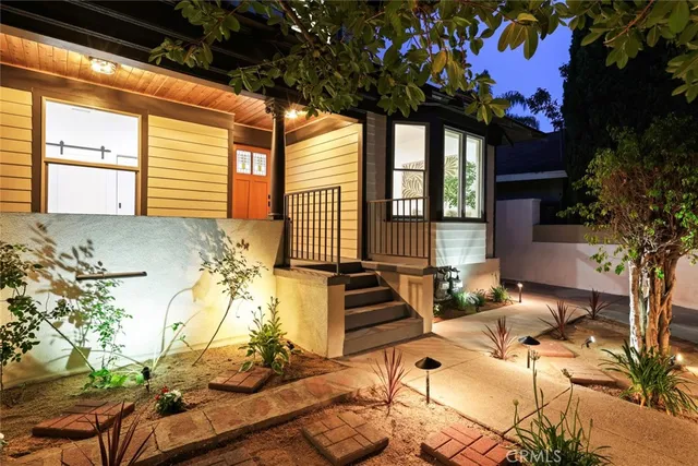 an aerial view of multiple houses with a yard