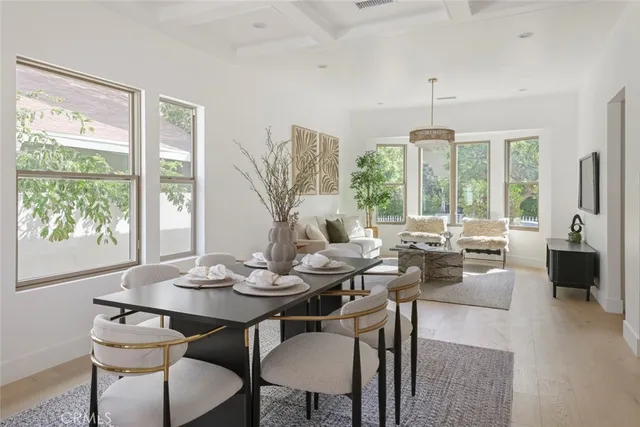 a living room with furniture and painting on the wall