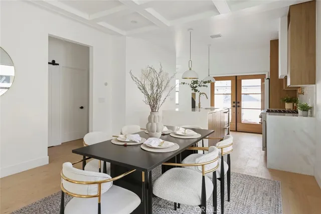 a living room with furniture a flat screen tv and a large window