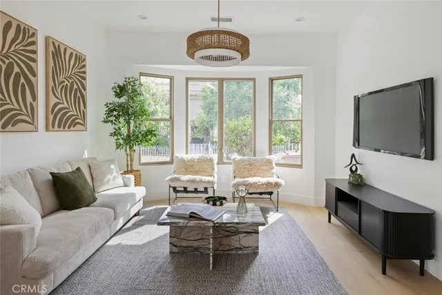 a view of a house with a tree