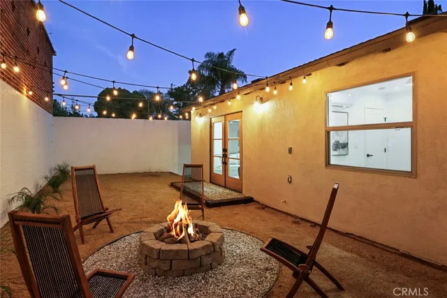 a living room with furniture a rug and a chandelier