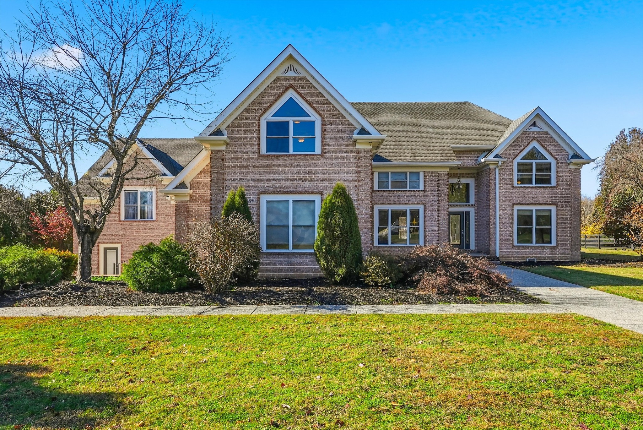 a front view of a house with a yard