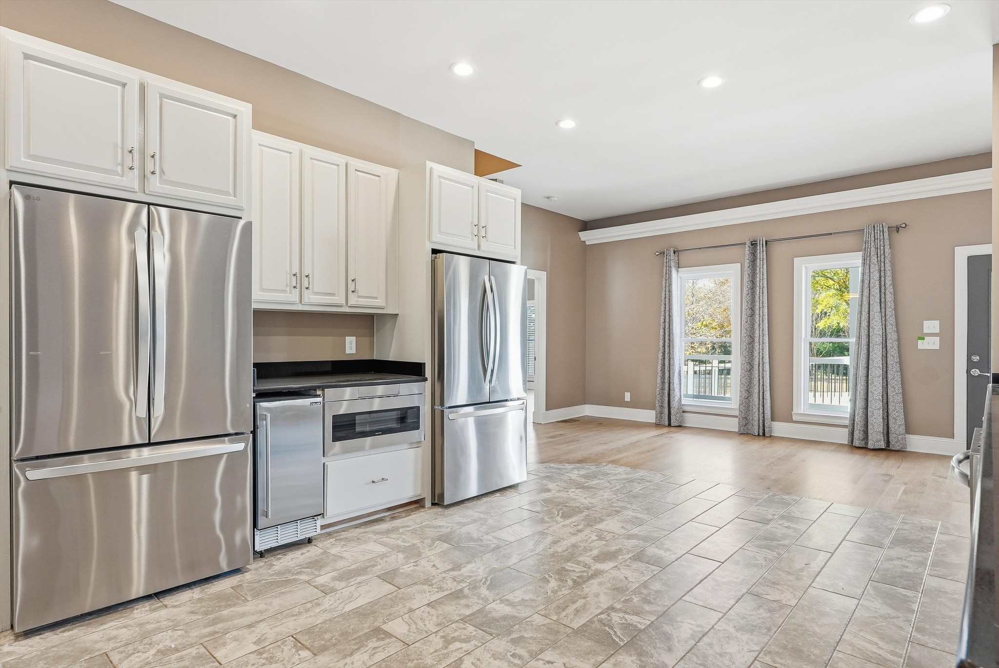 2005 Alan John Way Lebanon, TN 37087 - Photo 30 of 71 a kitchen with granite countertop a refrigerator and a stove top oven