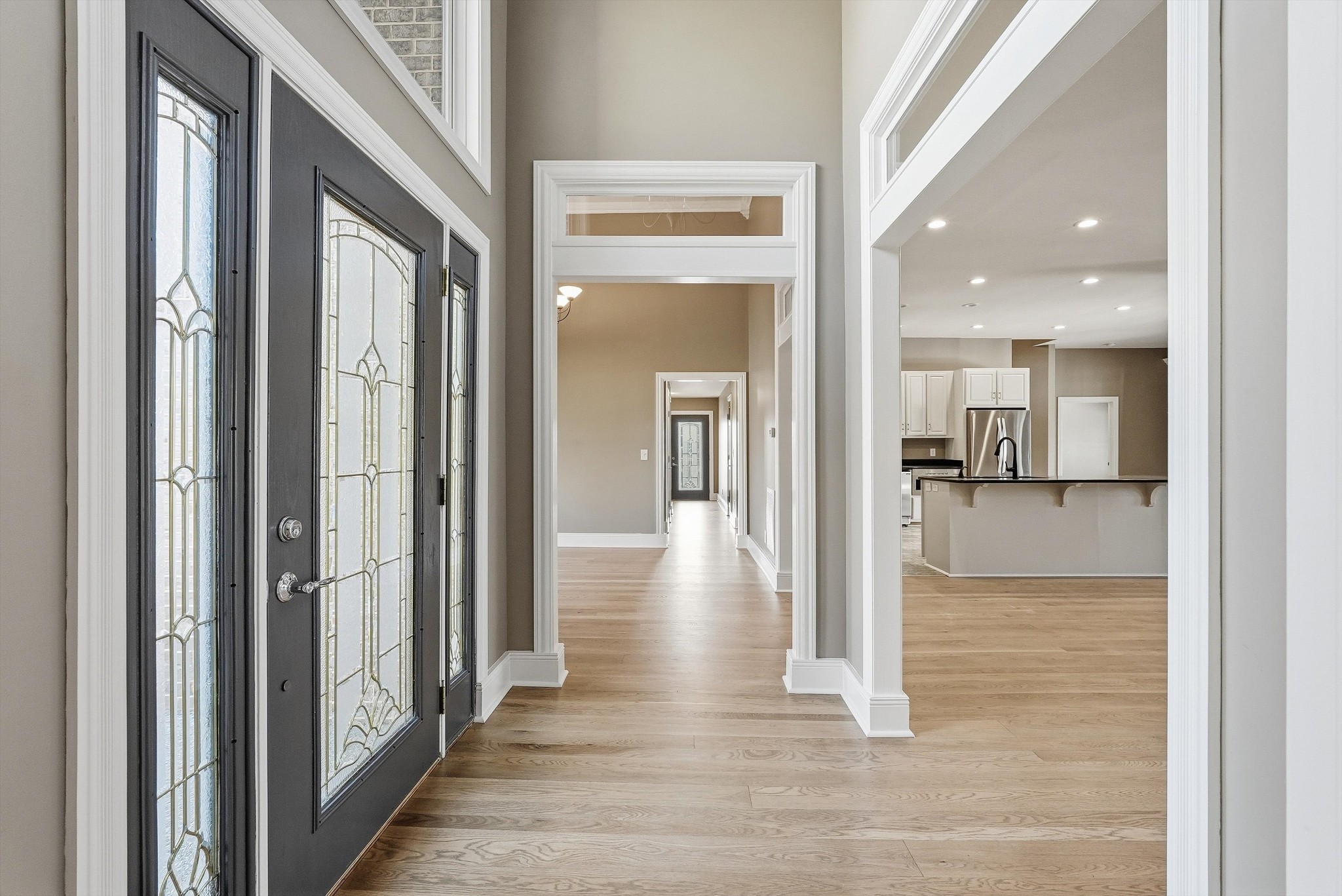 2005 Alan John Way Lebanon, TN 37087 - Photo 8 of 71 a view of a hallway with wooden floor a glass door and a bathroom