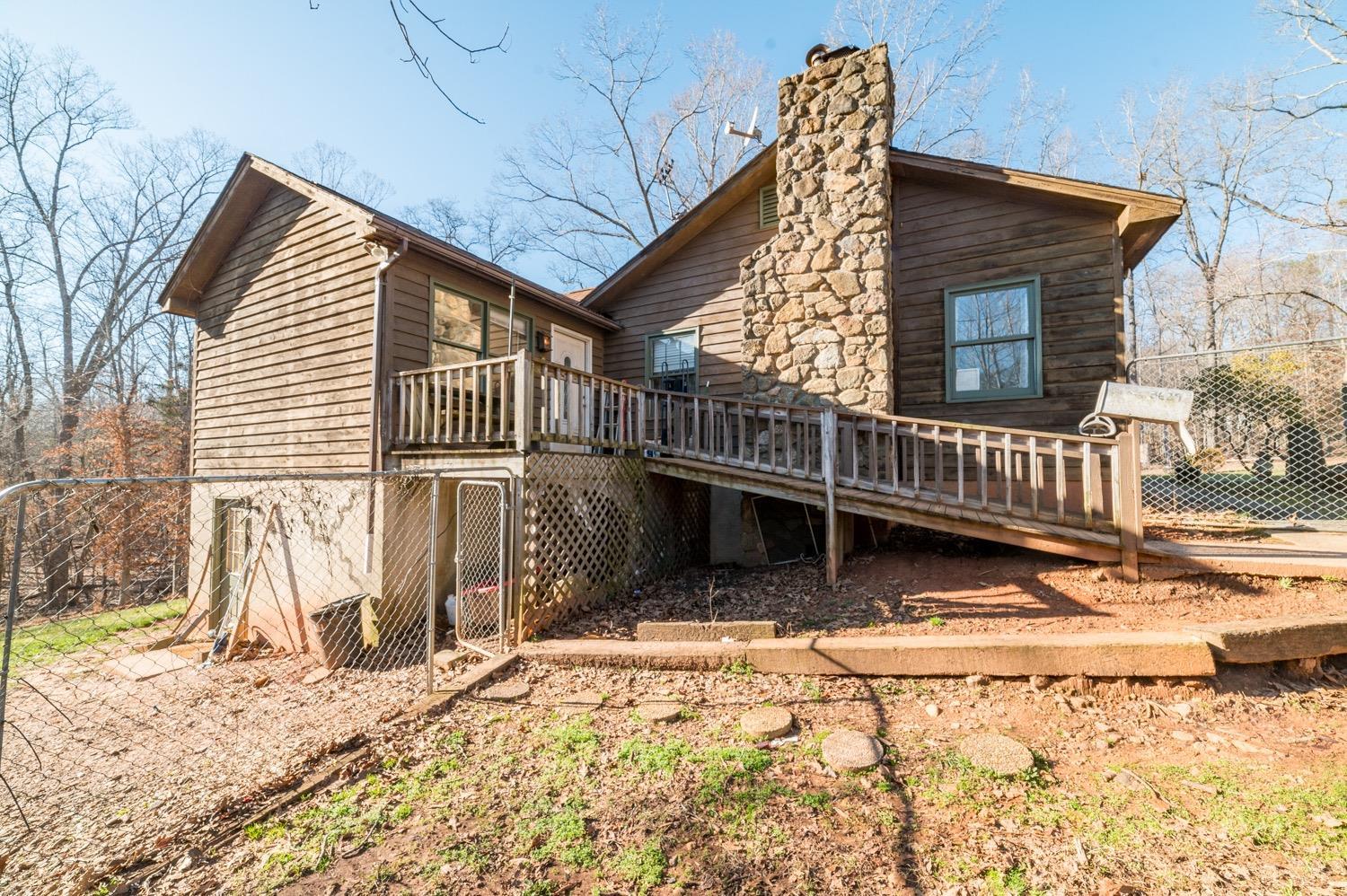 3629 Bear Creek Road Rustburg, VA 24588 - Photo 36 of 54 a view of a house with a wooden deck