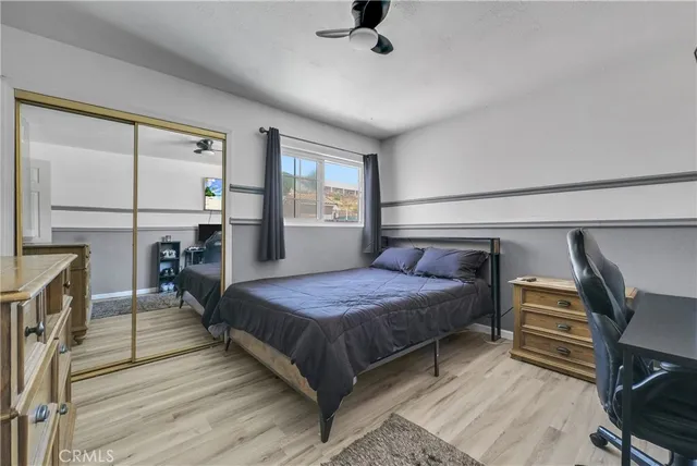 a bedroom with a bed and a table in it