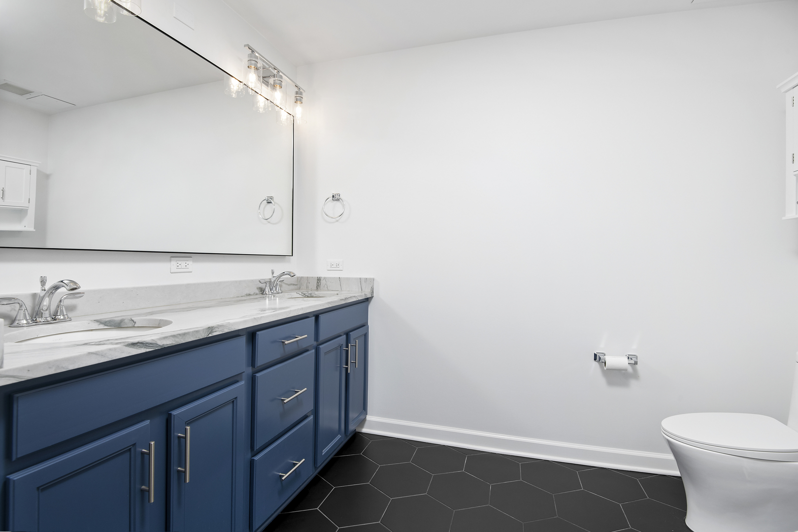 1629 South Prairie Avenue, Unit 1602 Chicago, IL 60616 - Photo 12 of 23 a bathroom with a granite countertop sink a toilet and a mirror