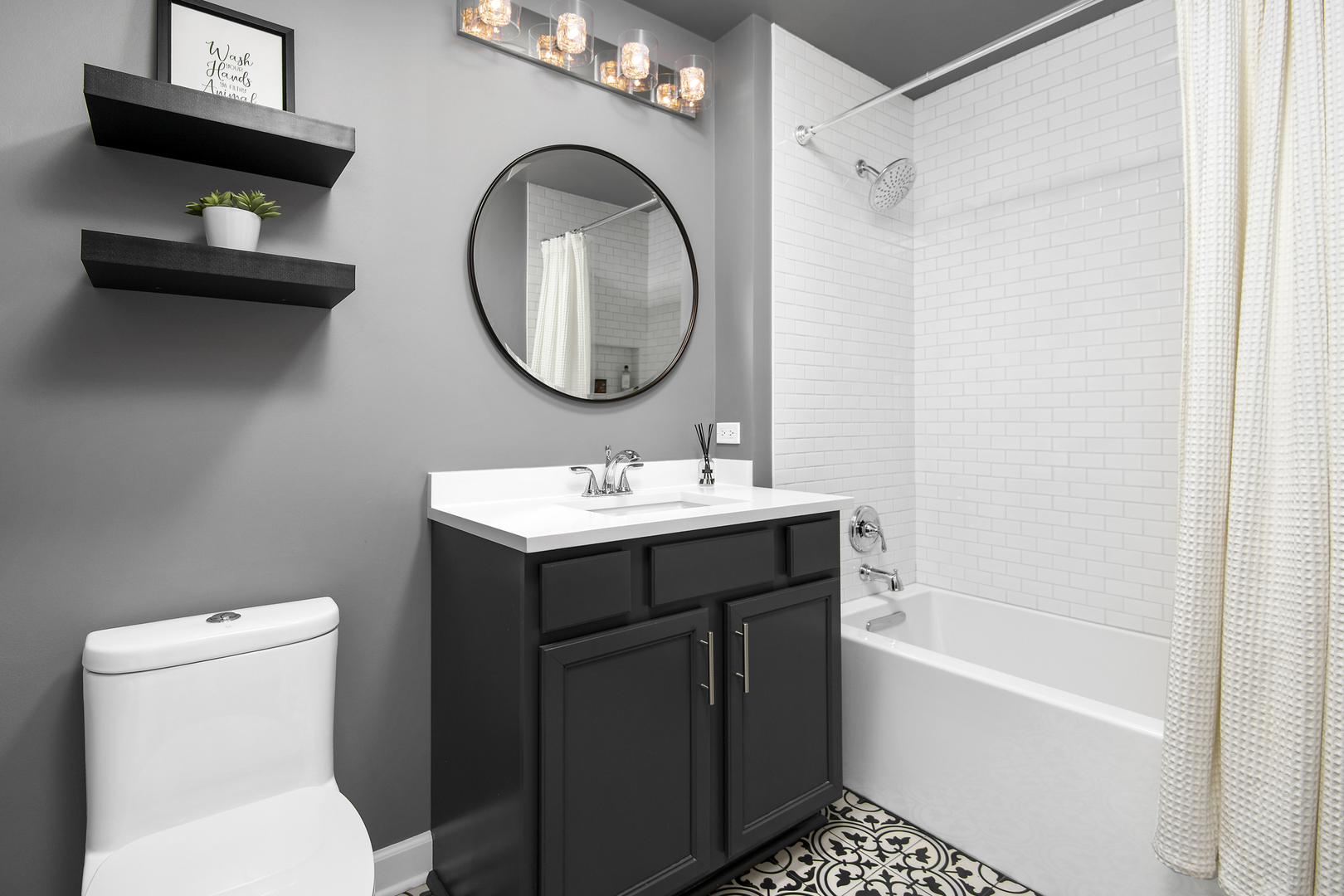 1629 South Prairie Avenue, Unit 1602 Chicago, IL 60616 - Photo 14 of 23 a bathroom with a sink a toilet and a mirror