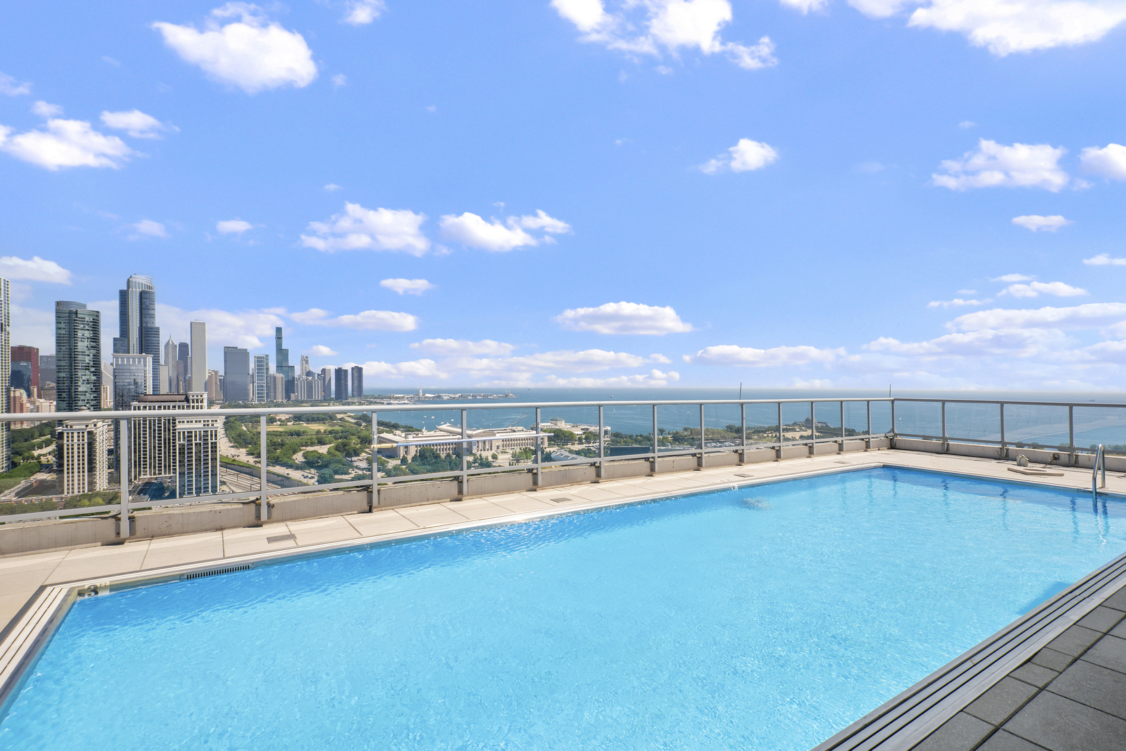 1629 South Prairie Avenue, Unit 1602 Chicago, IL 60616 - Photo 18 of 23 a view of swimming pool with outdoor seating and city view