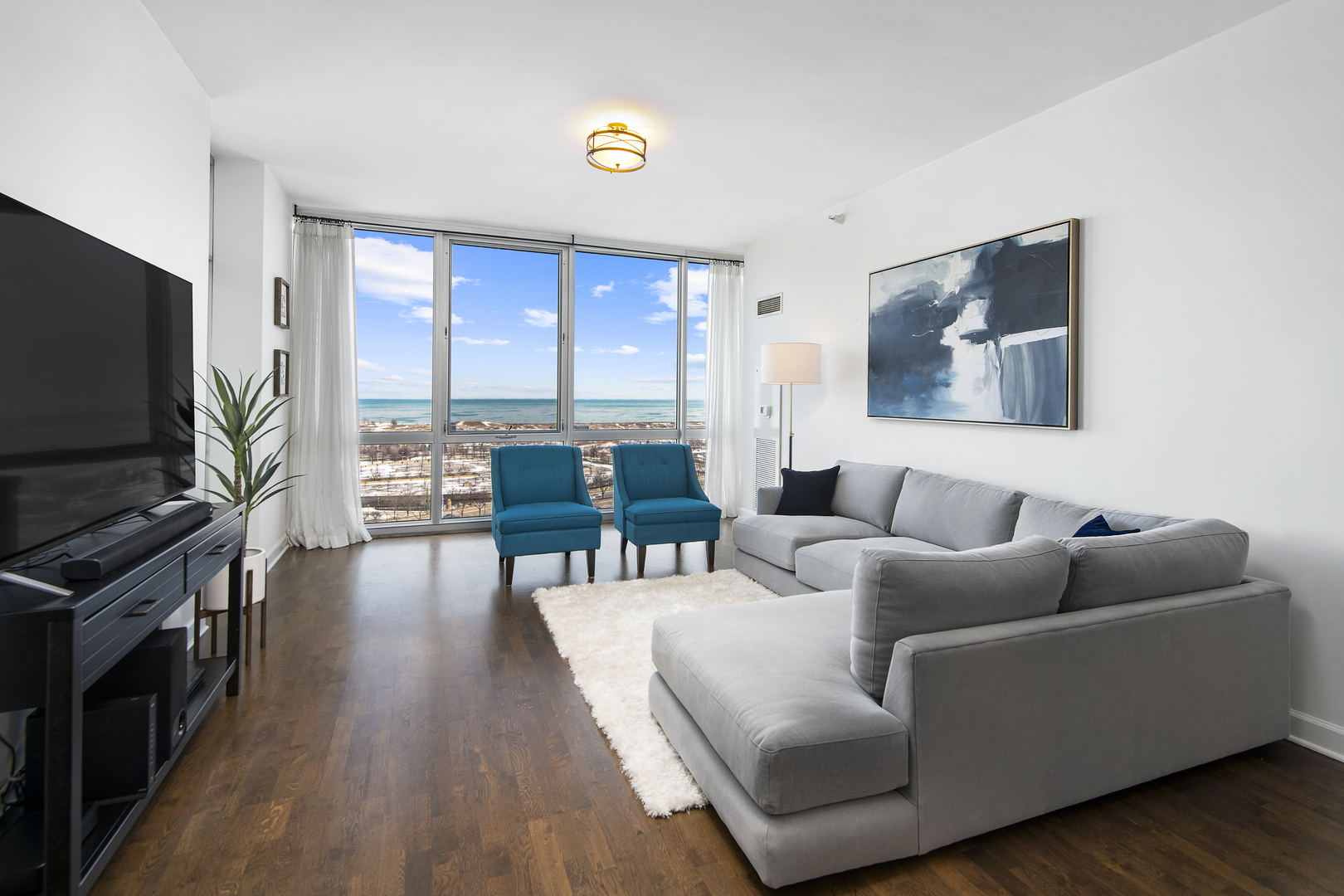 1629 South Prairie Avenue, Unit 1602 Chicago, IL 60616 - Photo 4 of 23 a living room with furniture and a flat screen tv