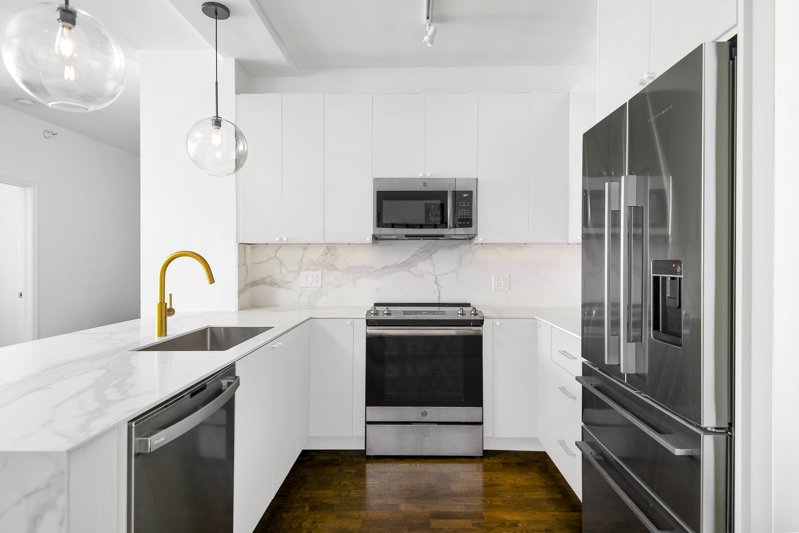 1629 South Prairie Avenue, Unit 1602 Chicago, IL 60616 - Photo 8 of 23 a kitchen with stainless steel appliances granite countertop a refrigerator and a stove top oven