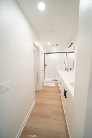 a bathroom with a sink and mirror