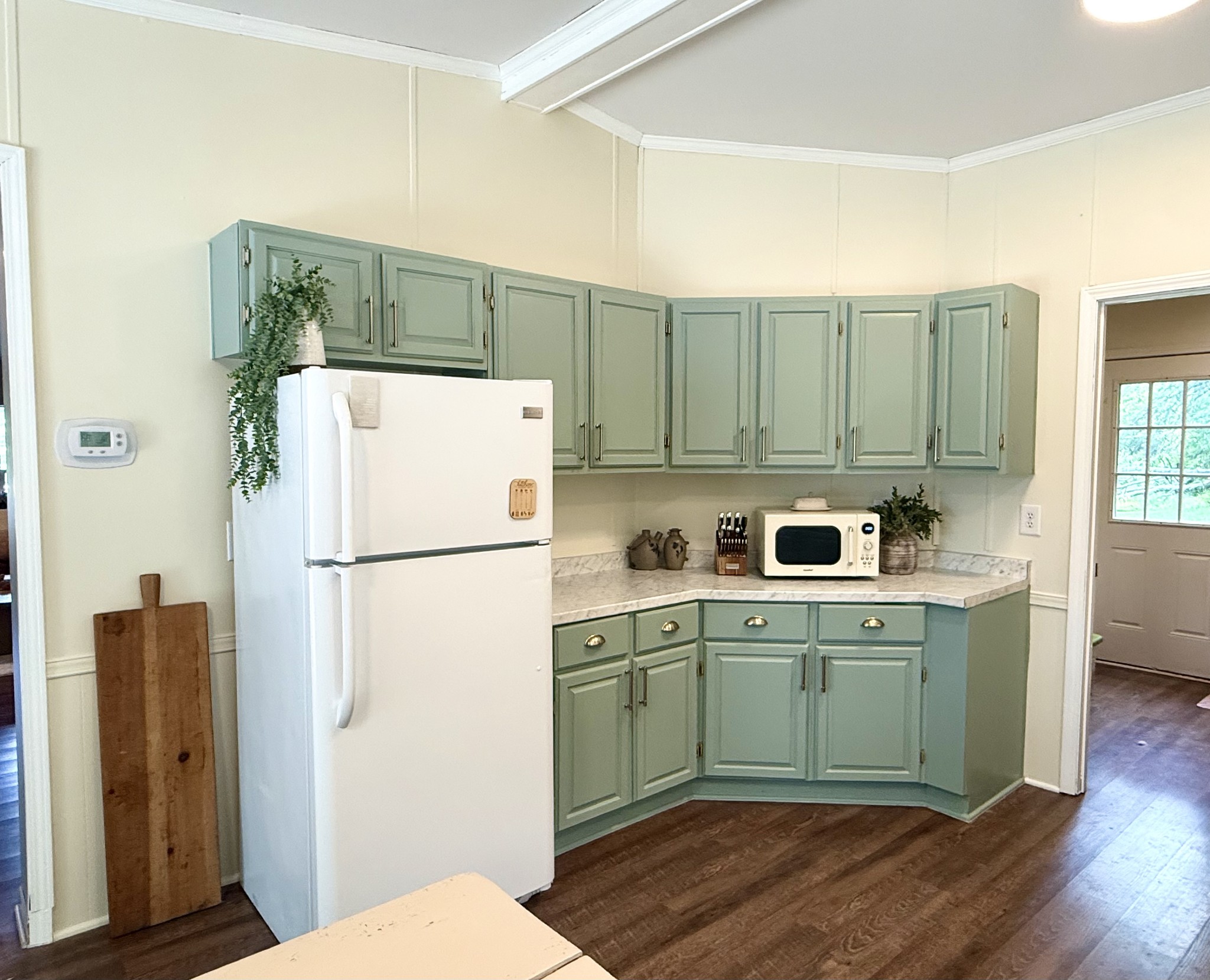 4002 Rippey Lake Road Mount Pleasant, TN 38474 - Photo 14 of 43 a kitchen with a refrigerator sink and cabinets
