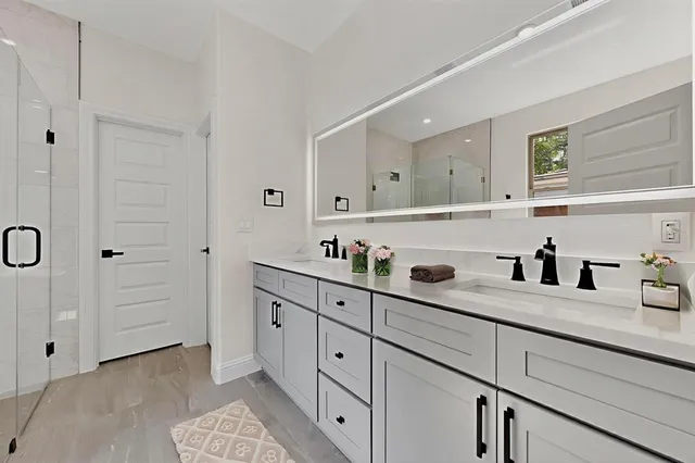 a bedroom with a bed and glass window